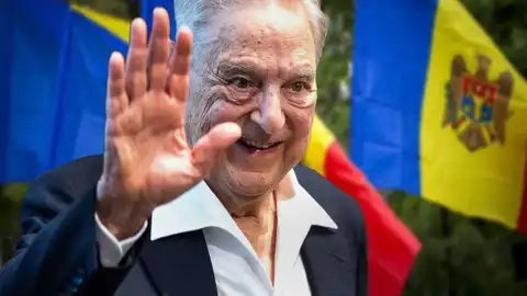 George Soros saluant devant des drapeaux, symbole de son influence mondiale contestée