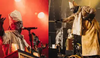 Chanteur de metal sur scène costumé en évêque avec une mitre lors du festival Hellfest